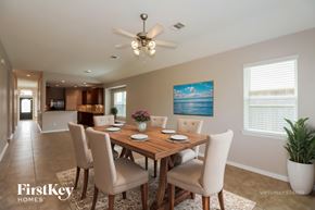 Baytown house for rent - A dining room with a wooden table and chairs.