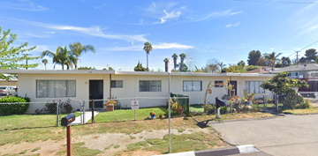 Vista apartment for rent - a house with a yard and a fence in front of it