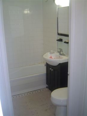 Toronto apartment for rent - a bathroom with a toilet and a sink and a tub