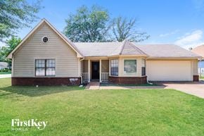Memphis house for rent - A house with a well-kept lawn in front of it.