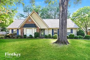 Germantown house for rent - A house with a tree in front of it.