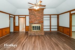 Germantown house for rent - A room with a fireplace and wood flooring.