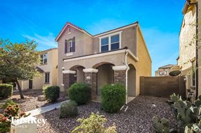 Glendale house for rent - a home with a gravel yard and cactus in front of it