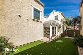 Glendale house for rent - the backyard of a house with a patio and green grass