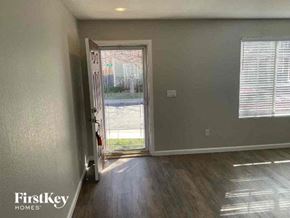 Thornton house for rent - an empty room with a door and a window