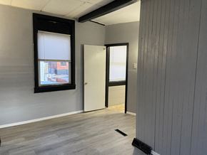 Reading apartment for rent - A room with a door and a window.