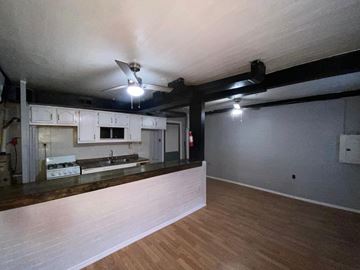 Reading apartment for rent - A kitchen with a counter and cabinets is shown.