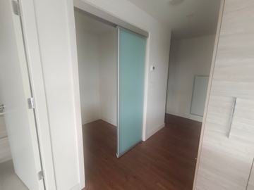 Coquitlam apartment for rent - a bedroom with a closet and a hard wood floor