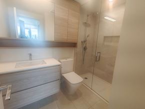 Coquitlam apartment for rent - a bathroom with a toilet and a shower