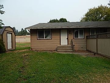 Coeur D'alene house for rent - a small house with a yard and a fence