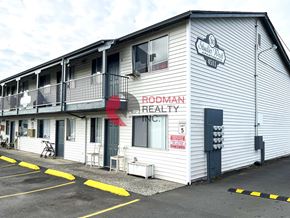 Longview apartment for rent - A building with a sign that says Rodman Realty Inc.