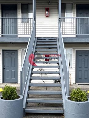 Longview apartment for rent - A staircase with a red sign that says "RETAIL SPACE" on it.