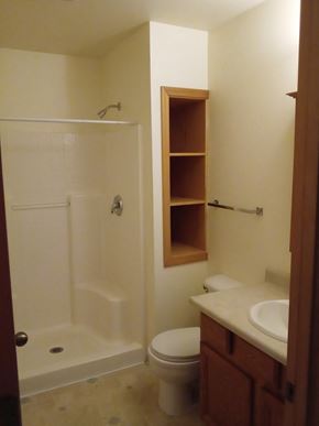 Longview apartment for rent - a small bathroom with a shower toilet and sink