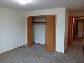 Longview apartment for rent - a bedroom with a closet and an open door