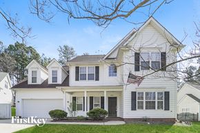 Waxhaw house for rent - a white house with an flag on the front