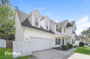 Waxhaw house for rent - a white house with white siding and a white fence