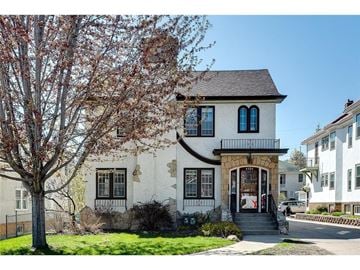 Minneapolis apartment for rent - a white house with a tree in front of it