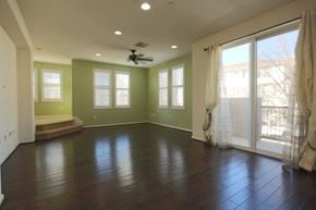 Livermore house for rent - A room with a ceiling fan and sliding glass doors.