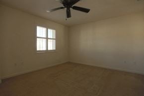 Livermore house for rent - A room with a ceiling fan and a window.