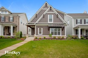 Westfield house for rent - two story house with gray siding and a green lawn