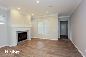 Westfield house for rent - a living room with a fireplace and wooden floors
