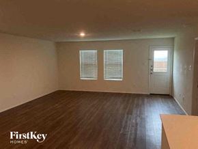 Princeton house for rent - A room with wooden flooring and a window with blinds.