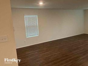 Princeton house for rent - A room with wooden flooring and a window with blinds.