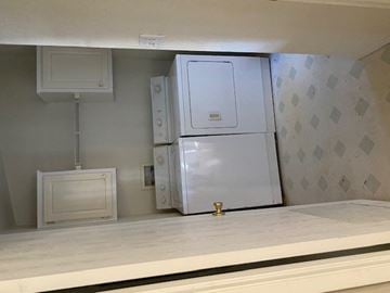 Garden Valley house for rent - a kitchen with a refrigerator and a washer and