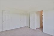 Ashburn apartment for rent - a bedroom with three doors and a carpeted floor