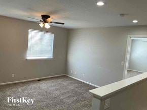 Thornton house for rent - a empty room with a ceiling fan and a window