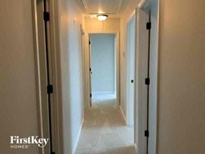 Mcdonough house for rent - a long hallway with a light on the ceiling