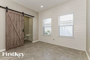 Fernandina Beach house for rent - the master bedroom has a large closet with a sliding barn door
