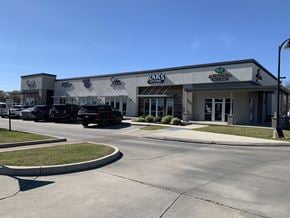 Youngsville apartment for rent - a shopping center with cars parked in front of it