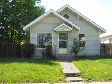 Coeur D' Alene house for rent - a white house with a sidewalk in front of it
