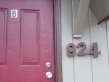 Coeur D Alene house for rent - a pink door with the numbers on it