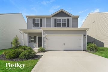 Charlotte house for rent - a white house with a white garage door