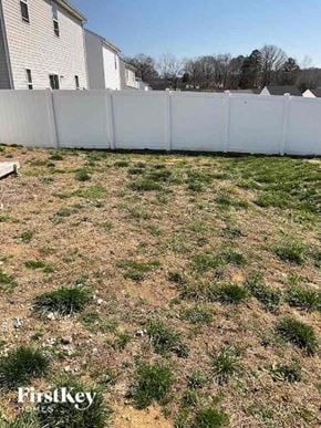 Charlotte house for rent - a yard with grass and a fence