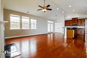 Summerville house for rent - A spacious kitchen with wooden floors and a ceiling fan.