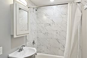 Forest Park apartment for rent - A white sink with a mirror above it.