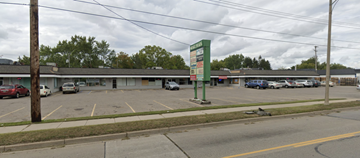 Lansing apartment for rent - A parking lot with cars parked in it.