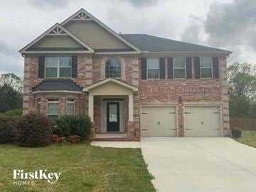 Conyers house for rent - a brick house with a sidewalk in front of it