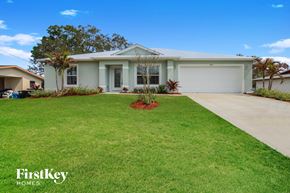 Palm Bay house for rent - a white house with a lawn in front of it