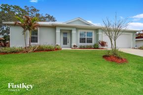 Palm Bay house for rent - a white house with a lawn in front of it