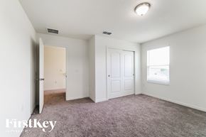 Winter Haven house for rent - a bedroom with carpet and a door to a closet