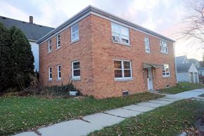 South Milwaukee apartment for rent - a brick house with a sidewalk in front of it
