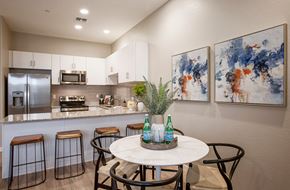 Phoenix apartment for rent - a kitchen with a counter and a table with stools