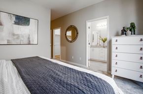 Phoenix apartment for rent - a bedroom with a bed and a bathroom with a sink