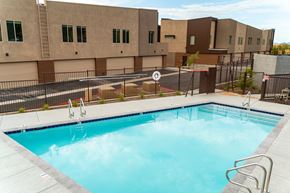 Phoenix apartment for rent - a swimming pool with a building in the background