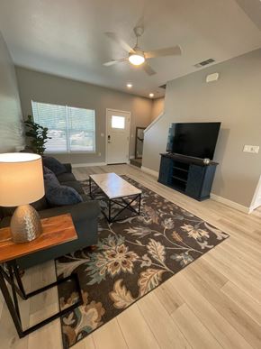 Chico apartment for rent - A living room with a couch, a coffee table, and a television.