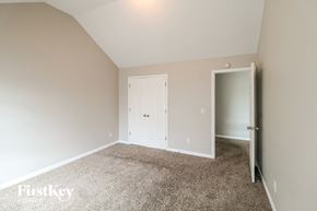 Lawrenceville house for rent - a bedroom with carpet and a white door